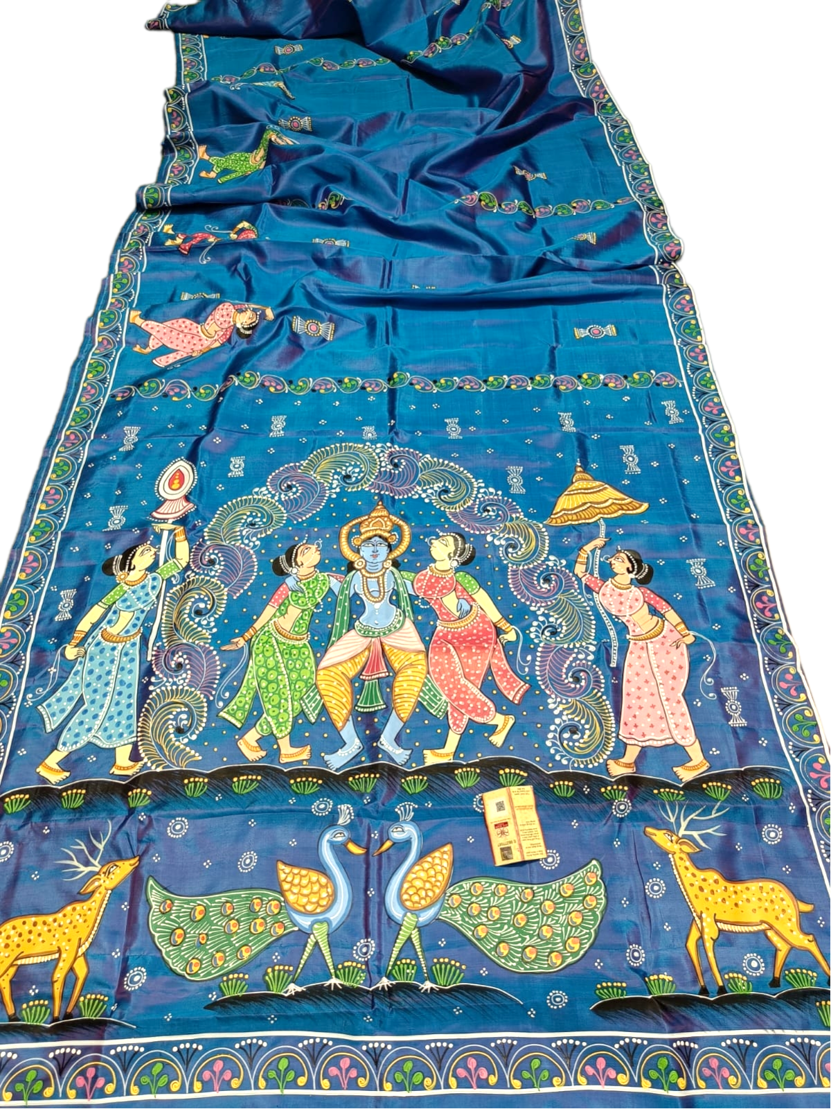 Blue silk saree with hand-painted Krishna Leela and Pattachitra art, featuring peacocks and deer.