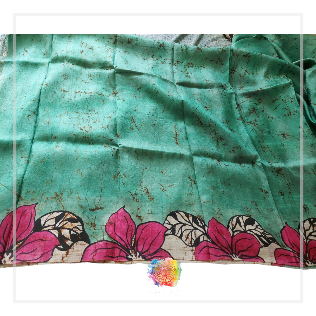 Teal batik silk saree with hand-painted pink floral border.