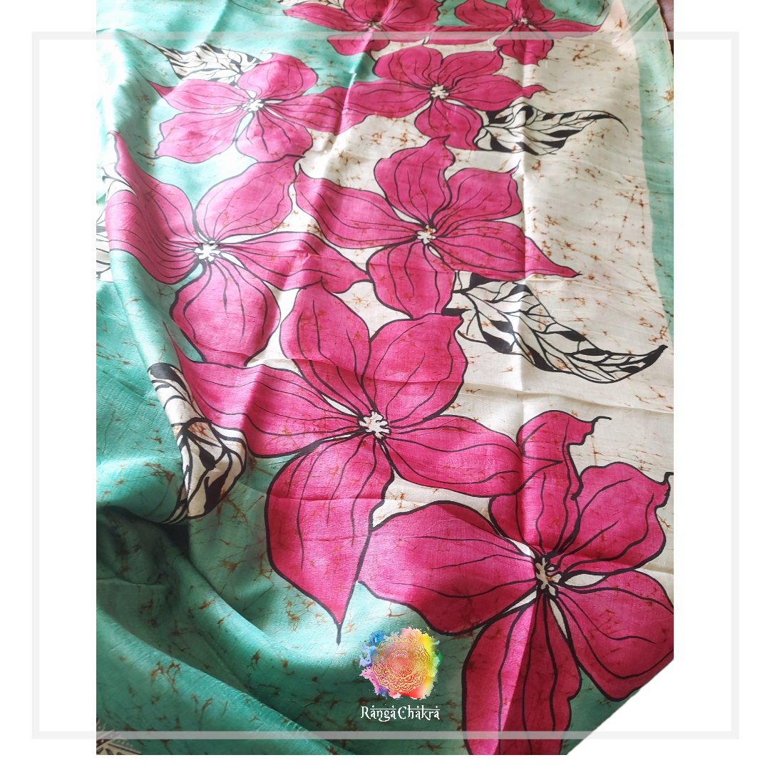 Hand-painted batik silk saree with pink floral design.