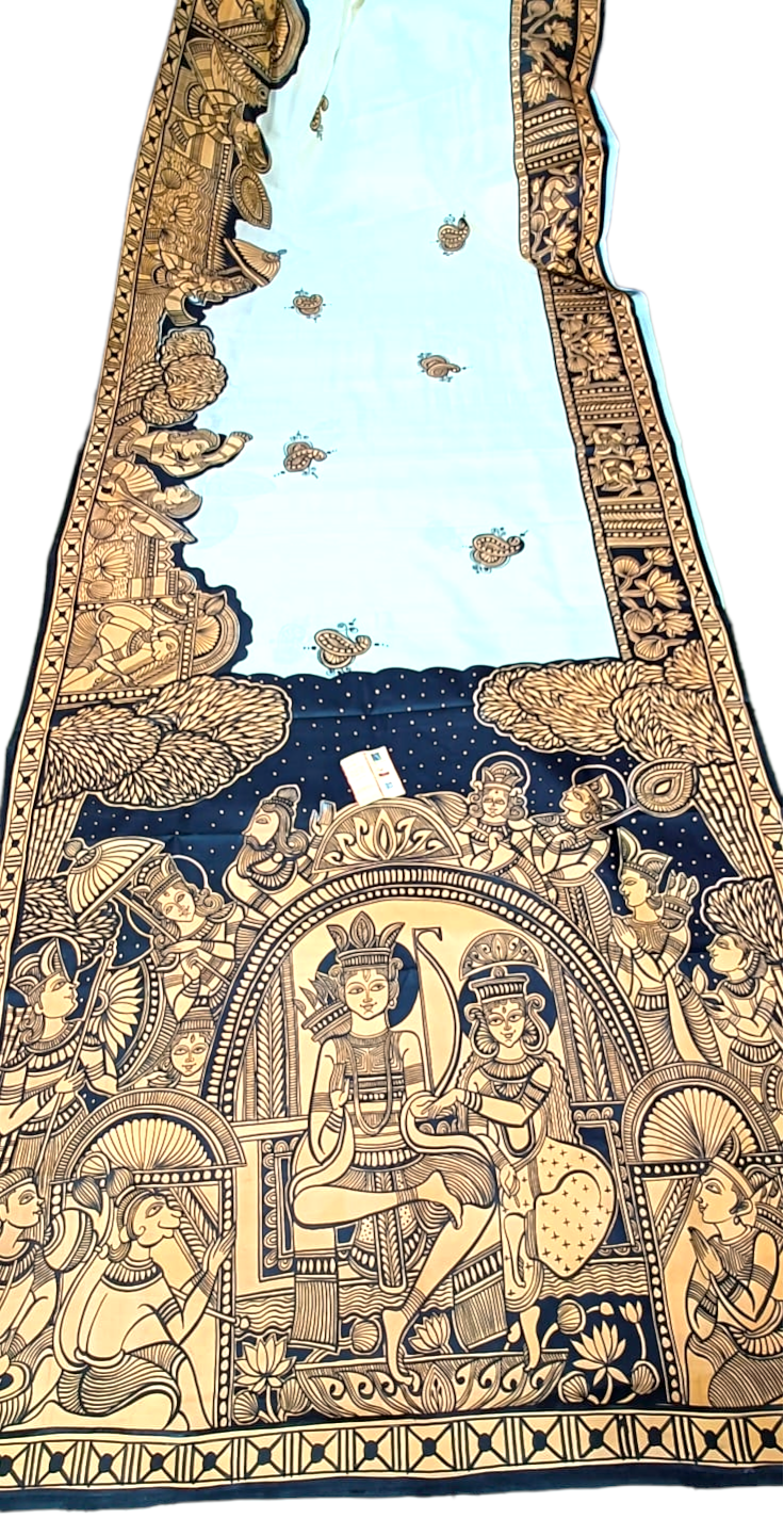 Hand-painted light blue saree with intricate black and gold mythological border design.