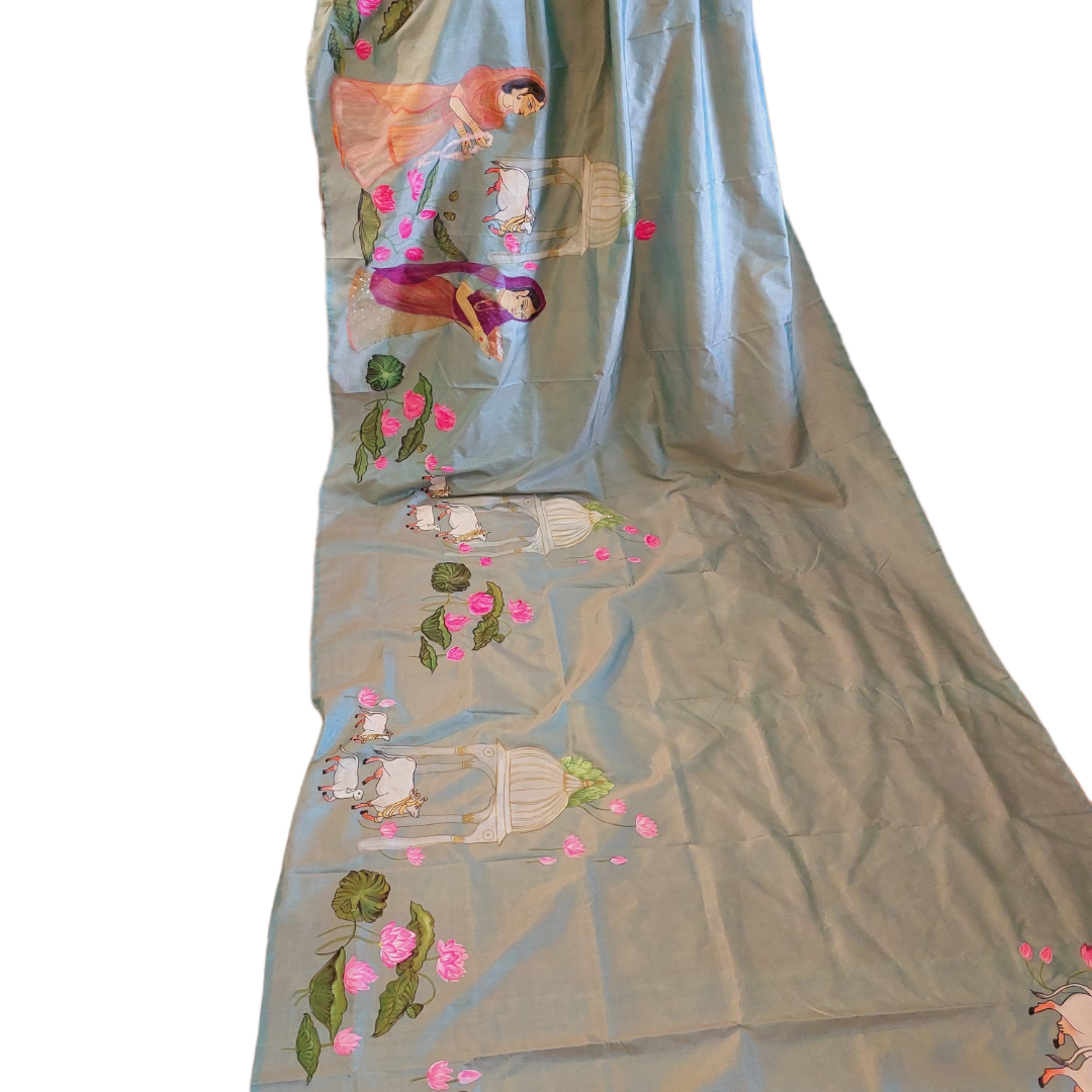 Blue Tussar silk saree with hand-painted Pichwai cow and lotus design.