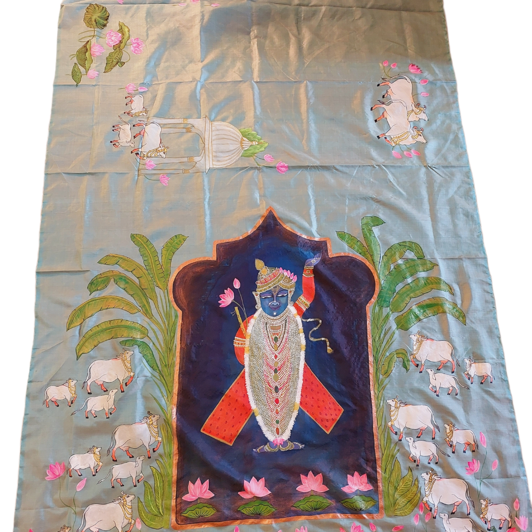 Hand-painted Pichwai Tussar silk saree with Krishna and cow motifs.