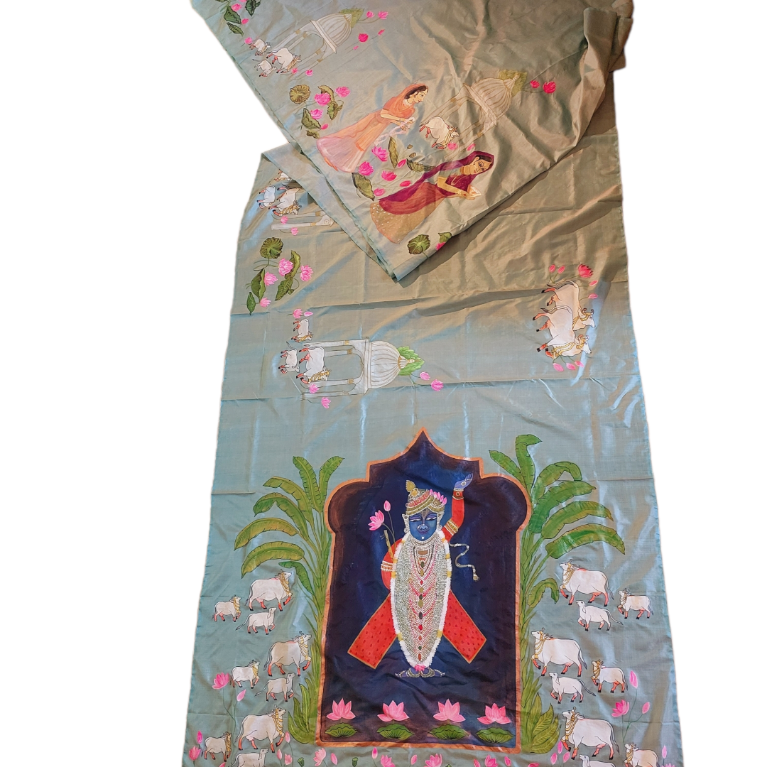 Hand-painted Pichwai Tussar silk saree with Krishna and cow motifs in blue.