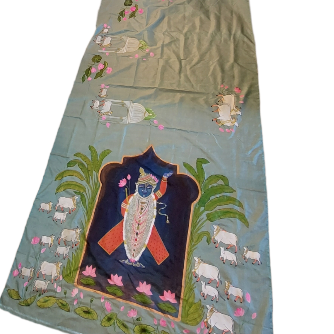 Blue Tussar silk saree with hand-painted Pichwai cow and Krishna design.