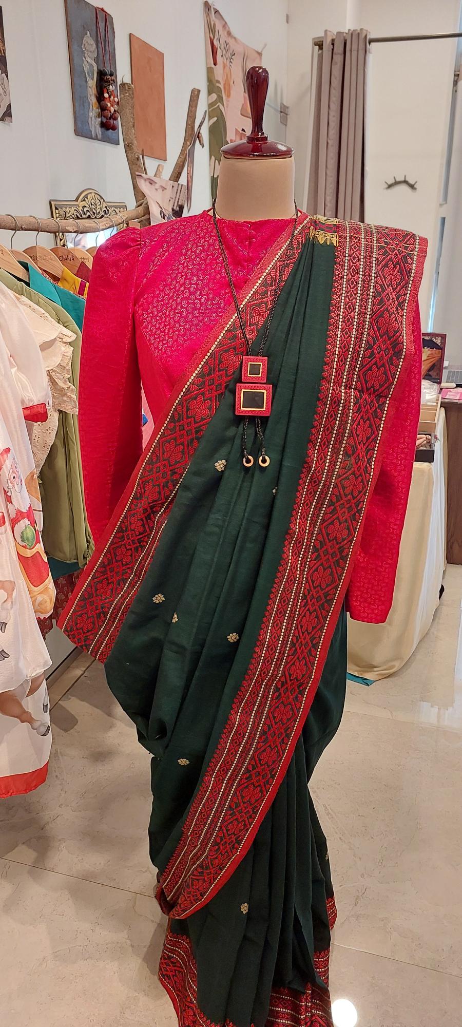 Shop handloom saree Dark green begumpuri saree with abstract weave border exudes timeless elegance and comfort. Handwoven saree is Perfect for office wear and formal meetings.