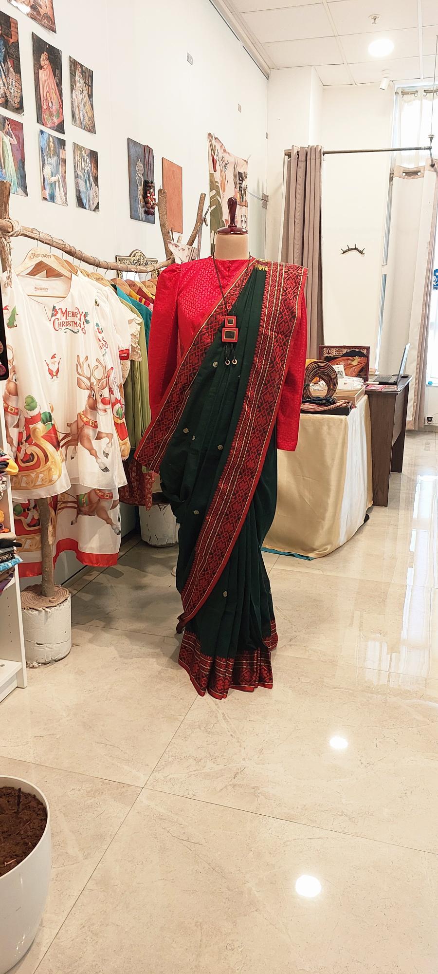 Shop handloom saree Dark green begumpuri saree with abstract weave border exudes timeless elegance and comfort. Handwoven saree is Perfect for office wear and formal meetings.