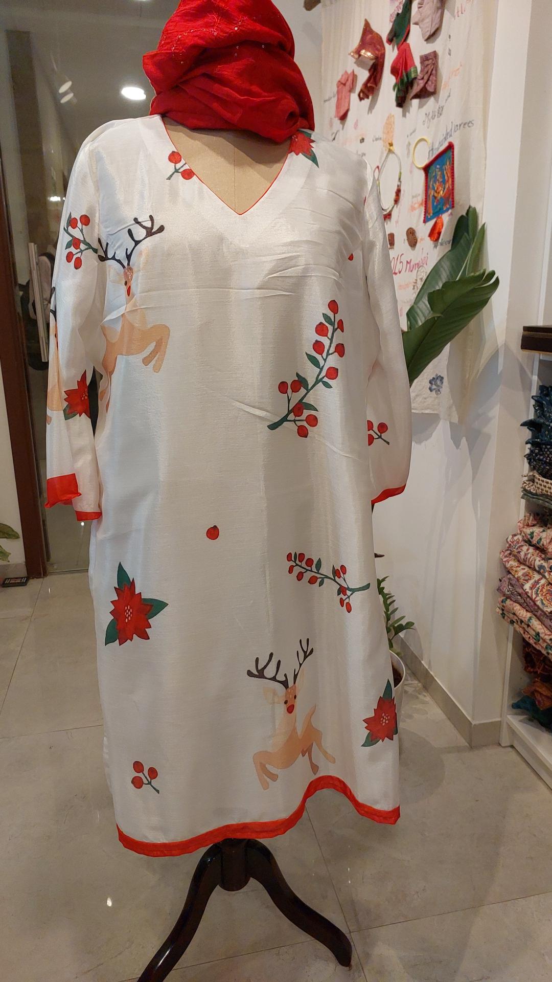 White dress for Christmas with red accents and floral patterns 